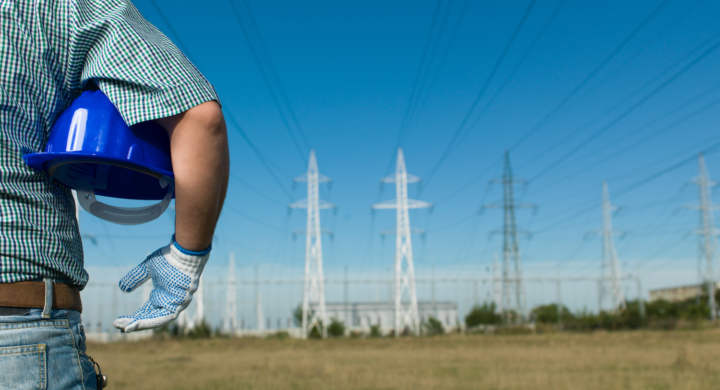 engineer-looking-at-power-lines