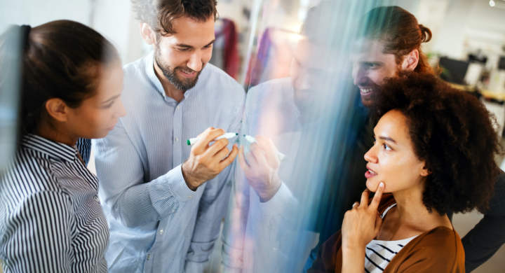 Collaboration and analysis by business people working together in office