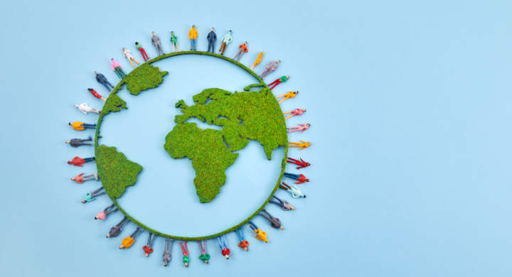World Population Day, creative concept. Large and diverse group of people in the shape of the world map.