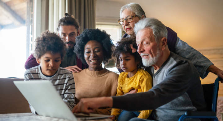 Portrait of a happy multigenerational multiethnic family at home. People group technology love concept