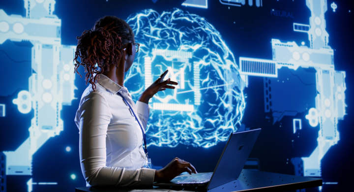 Certified expert using laptop to maintenance artificial intelligence neural networks made up of interconnected nodes. Computer scientist using AI system aiding in processing information