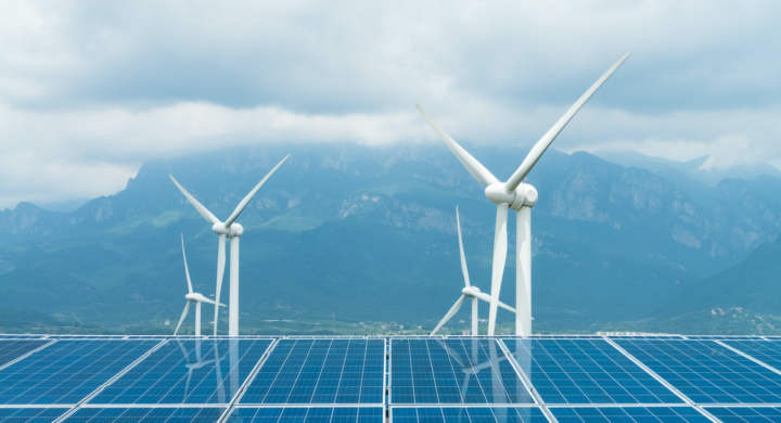 sustainable clean energy, solar panel and wind turbines closeup