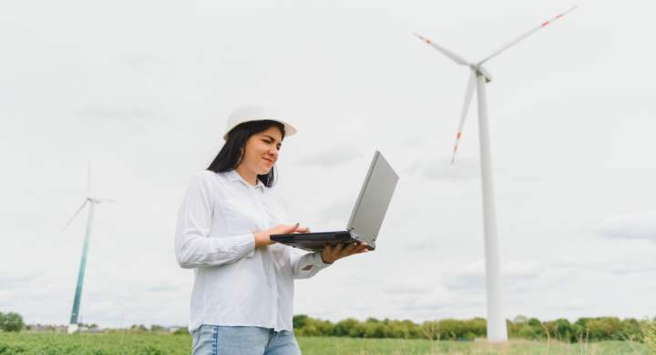 environmental-engineer-with-a-laptop-at-wind-farm