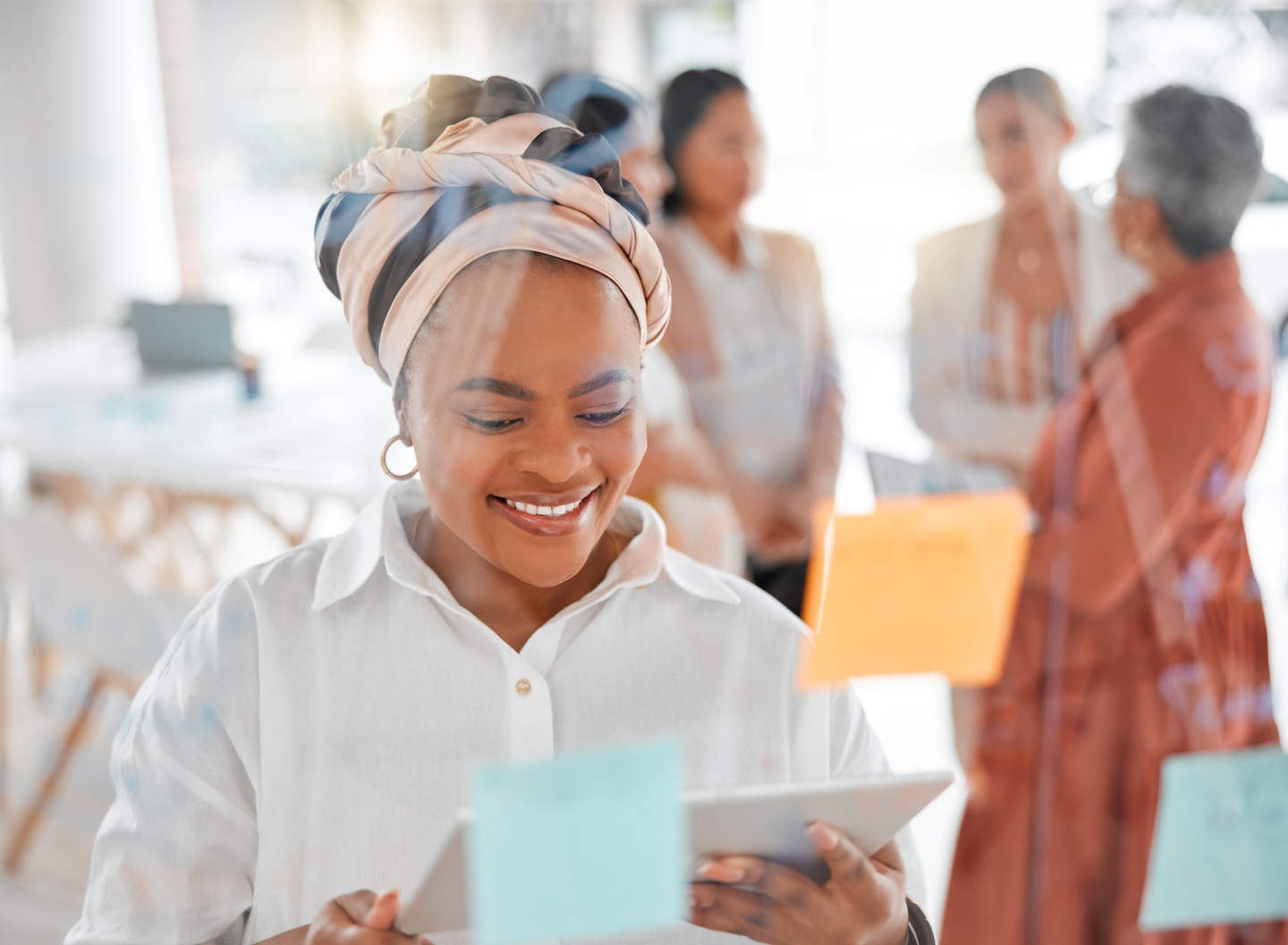Digital tablet, agenda and schedule planning by black woman in office, creative and sticky notes.