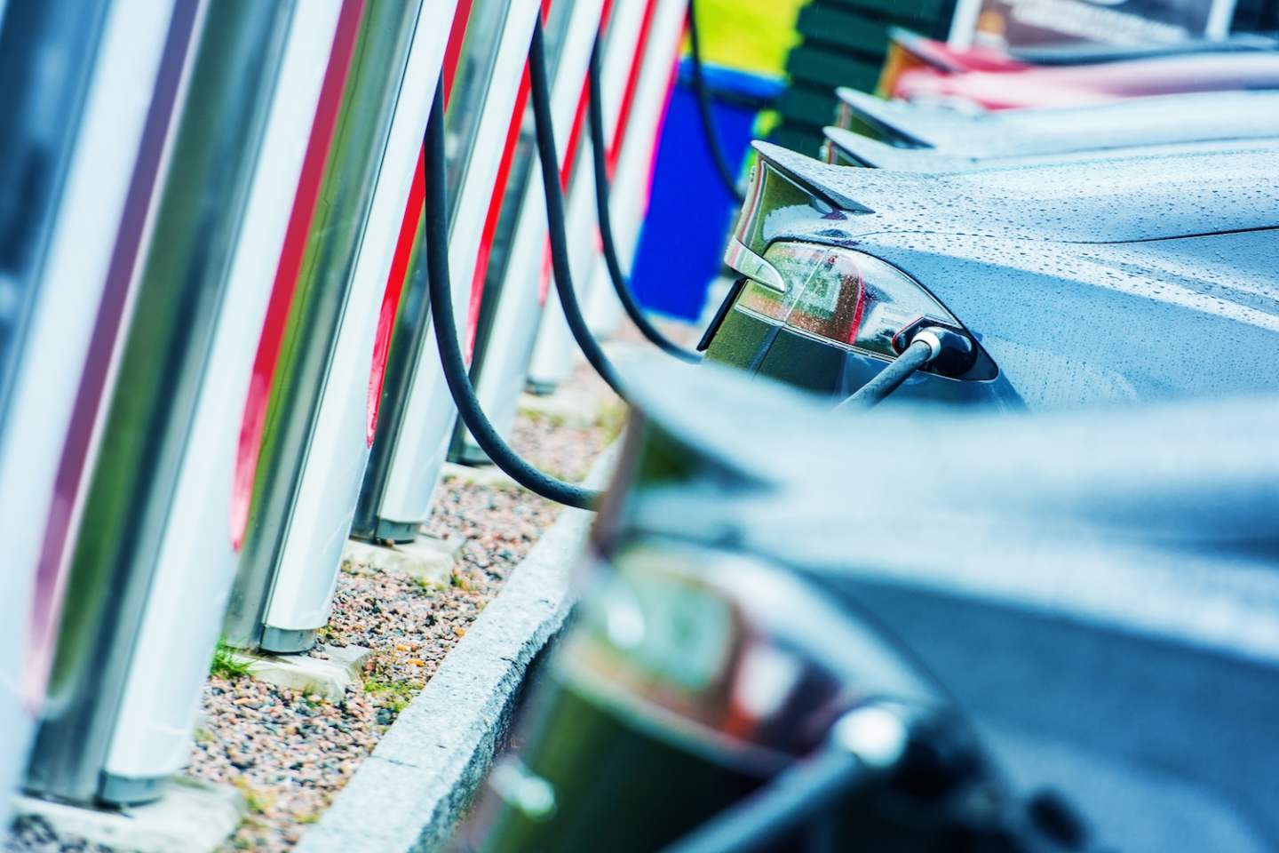 Charging Electric Vehicles Using Public Outdoor Electric Chargers. Modern Electric Cars in Use. Future of Transportation.