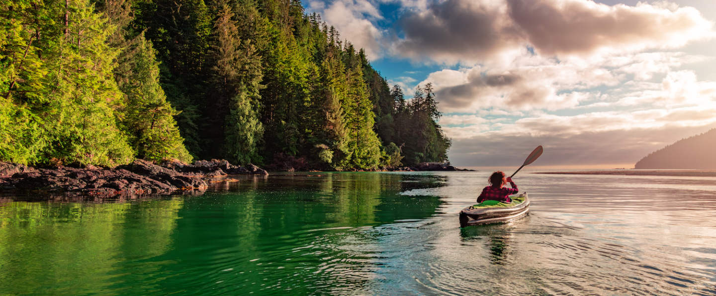Kayaking in Canadian Nature Landscape on the West Coast of Pacific Ocean. Background Panorama. San Josef Bay, Vancouver Island, BC, Canada.