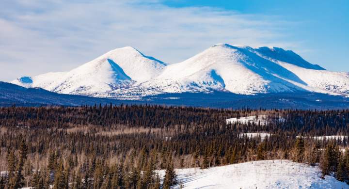Winter mountain landscape of boreal forest taiga wilderness of Yukon Territory, Canada, north of Whitehorse