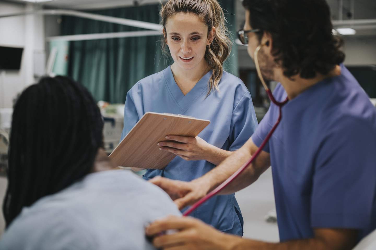 Young male physician examining a patient