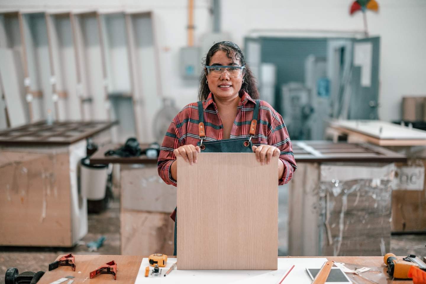 Carpenters get order via digital device , analyze blueprint, measure, install, combine, and secure manufactured furniture's components and fixtures. Verifying the quality, and preparing for shipment.