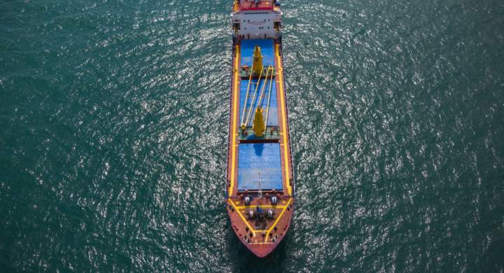 Large general cargo ship tanker bulk carrier, aerial top view.