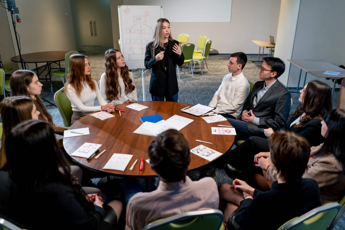 business conference or meeting at the hotel the manager tells colleagues the development plan for company
