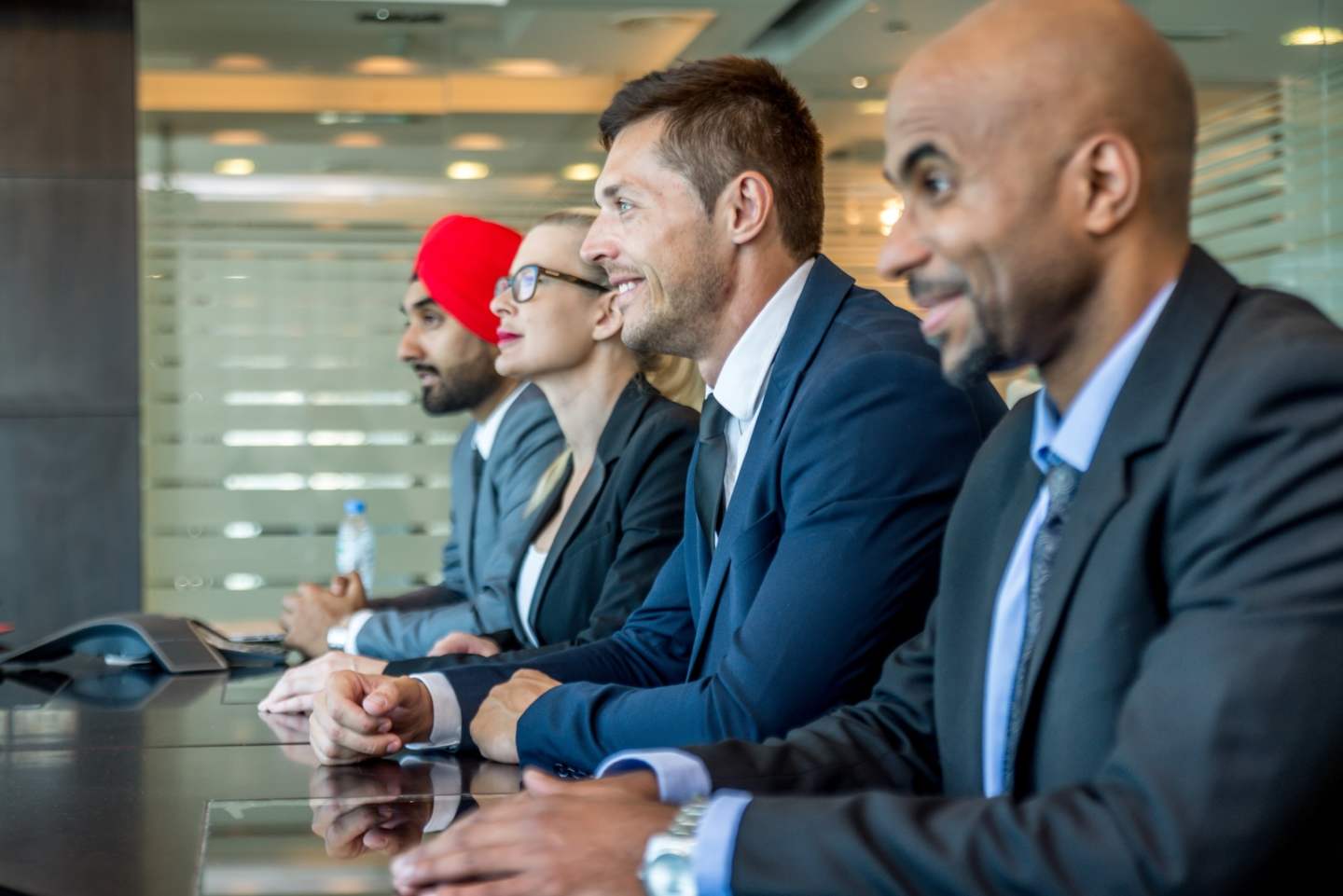 Multicultural business people meeting and talking about business - Multiracial business team meeting