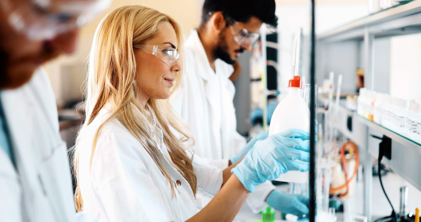 Young students of chemistry working together in laboratory