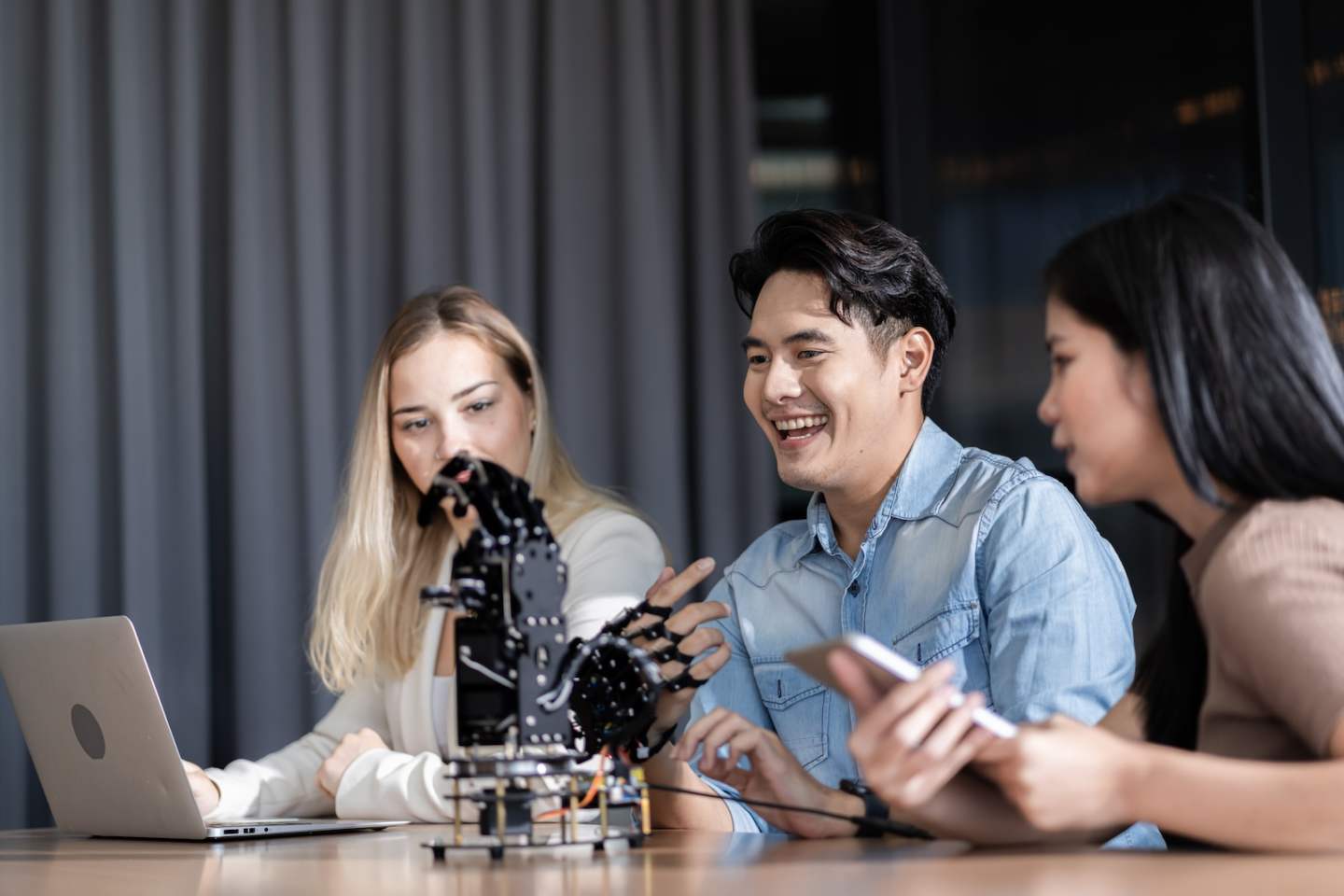Young students researching inventions with modern technology in university libraries.