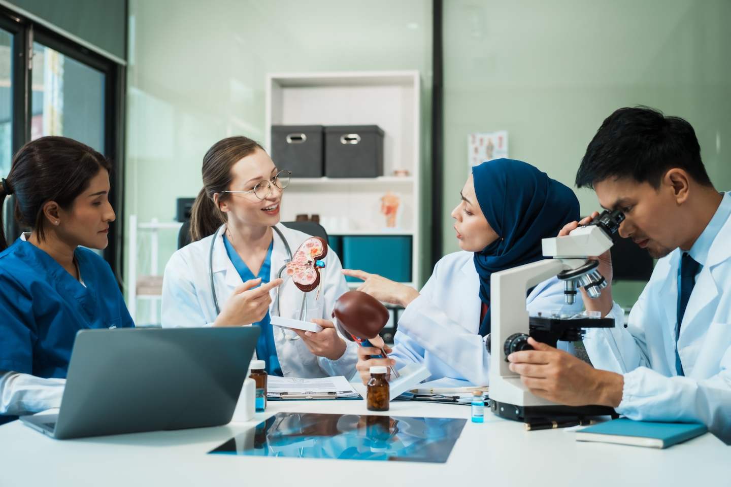 A diverse group of healthcare professionals, including doctors, nurses, and specialists