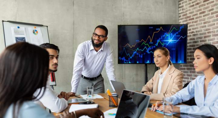 Business Training. Diverse Multiethnic Colleagues Having Conference Meeting In Boardroom, Group Of Multicultural Coworkers With Black Ceo Brainstorming In Modern Office, Discussing Company Strategy