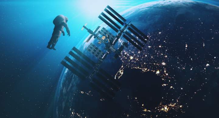 ISS astronaut in outer cosmos Earth background. International Space Station modul fly to spaceman against realistic planet. Sun Shine. 3d render animation. Elements of this media furnished by NASA