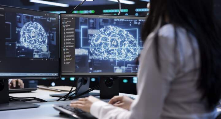 Programmer using AI tech on computer to do maintenance in server room providing storage. Worker in data center workplace using PC to enable artificial intelligence to process datasets for training