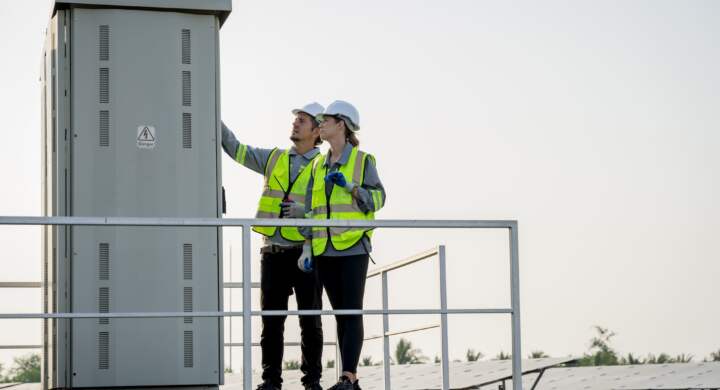 Electrical engineer on solar farm with large structure Check maintain rehearse damaged parts from use in order to produce electricity with maximum efficiency throughout its service life professionally