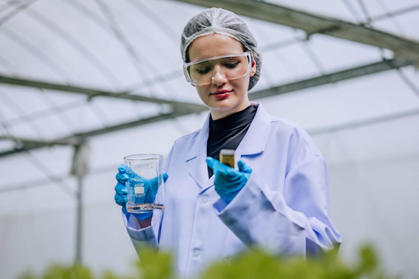 Hydroponic scientist employs a pH meter as a valuable tool for quality control, guaranteeing the optimum conditions required to produce sustainable and uncontaminated water in the cultivation process