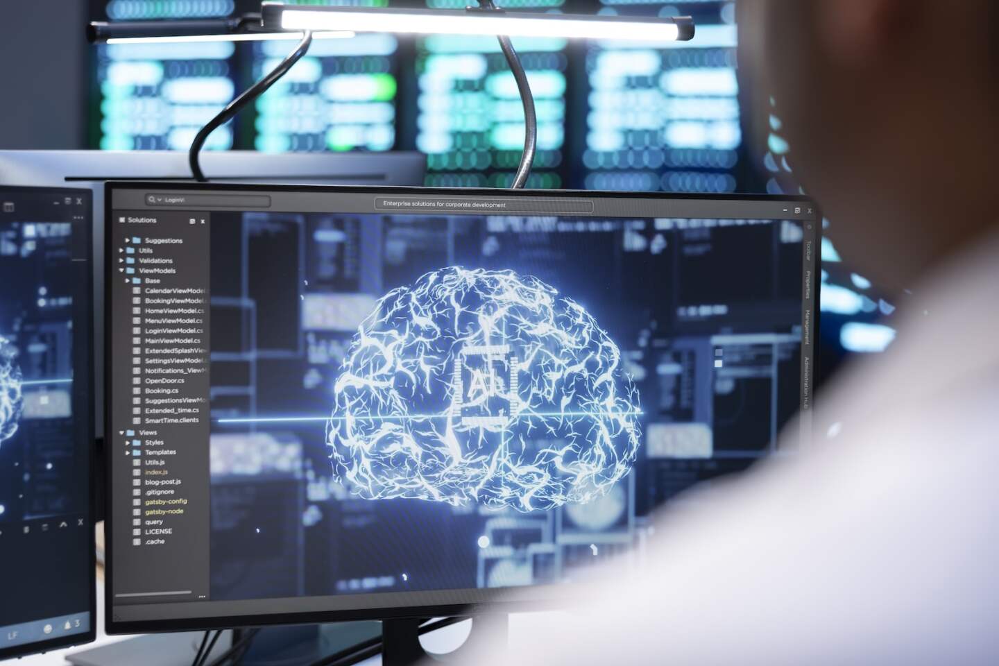 Engineer using AI tech on computer to do checkup in server farm providing storage. IT expert using PC to enable artificial intelligence to process datasets for training and inference