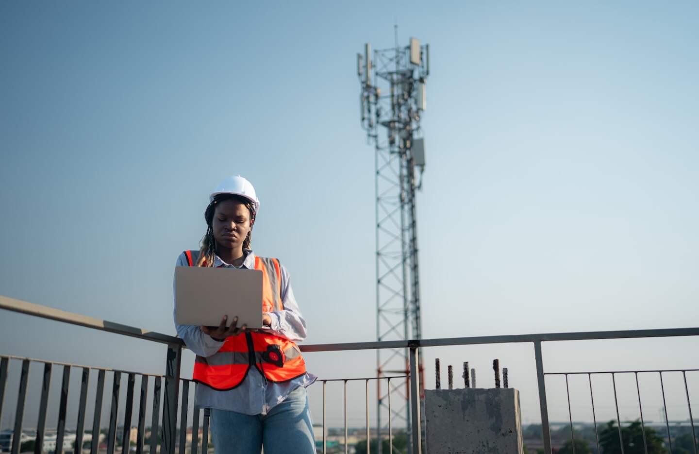 Engineer working on a building site The telephone and internet network signal systems of the construction building are being inspected.
