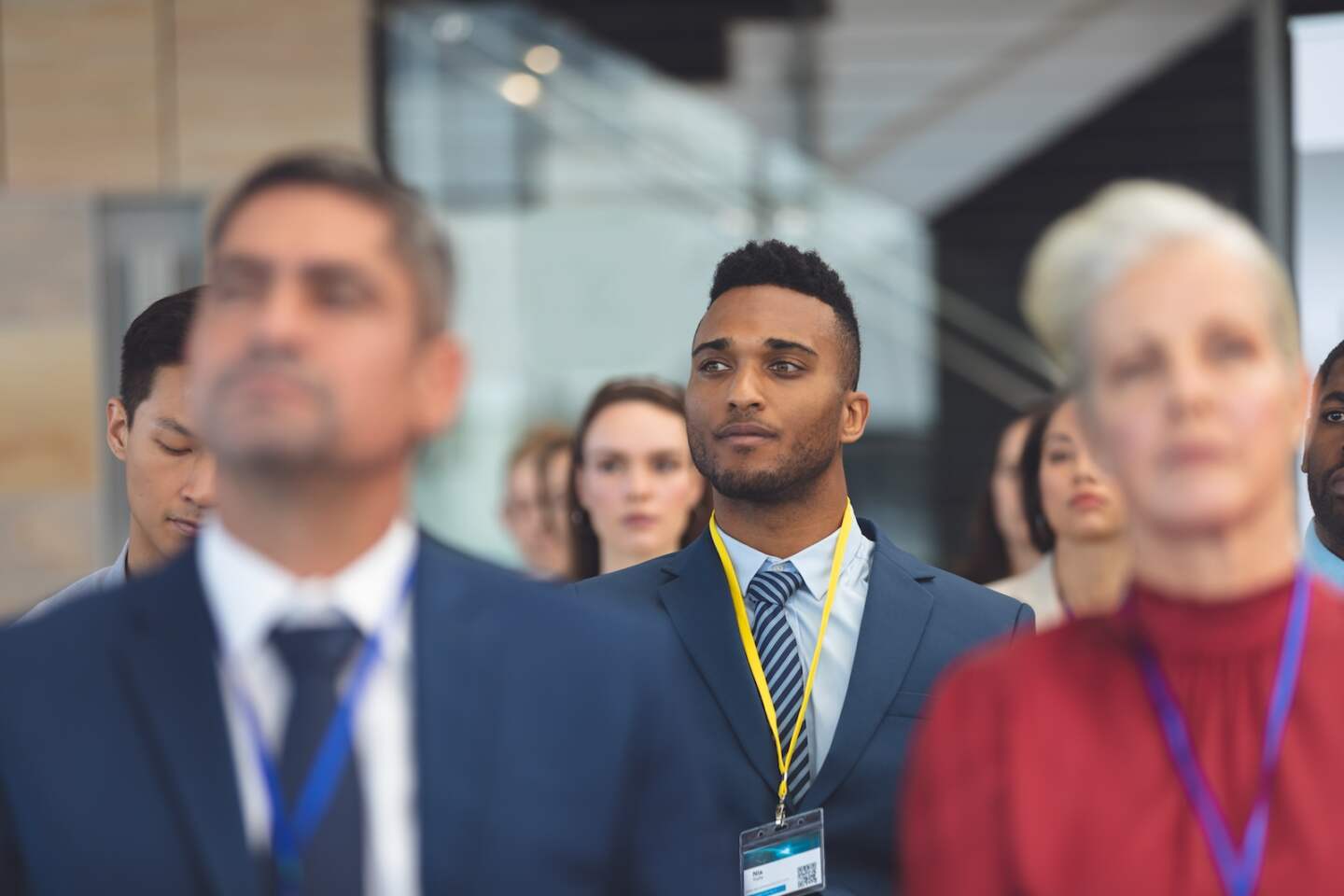Front view of attentive young African american businessman in a business seminar in office building