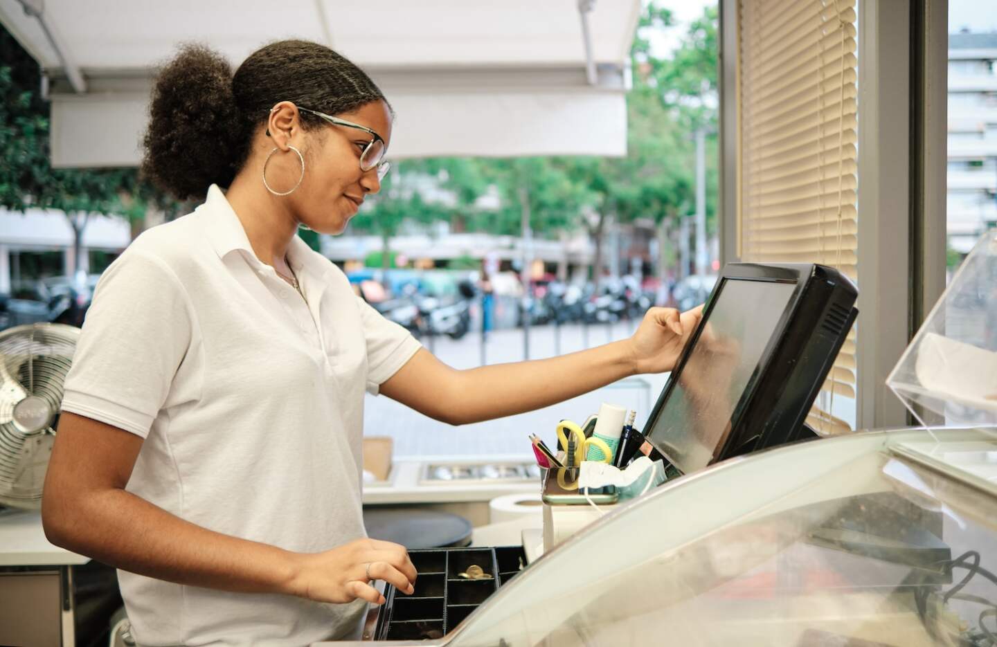 Profile of an african worker using the cash register
