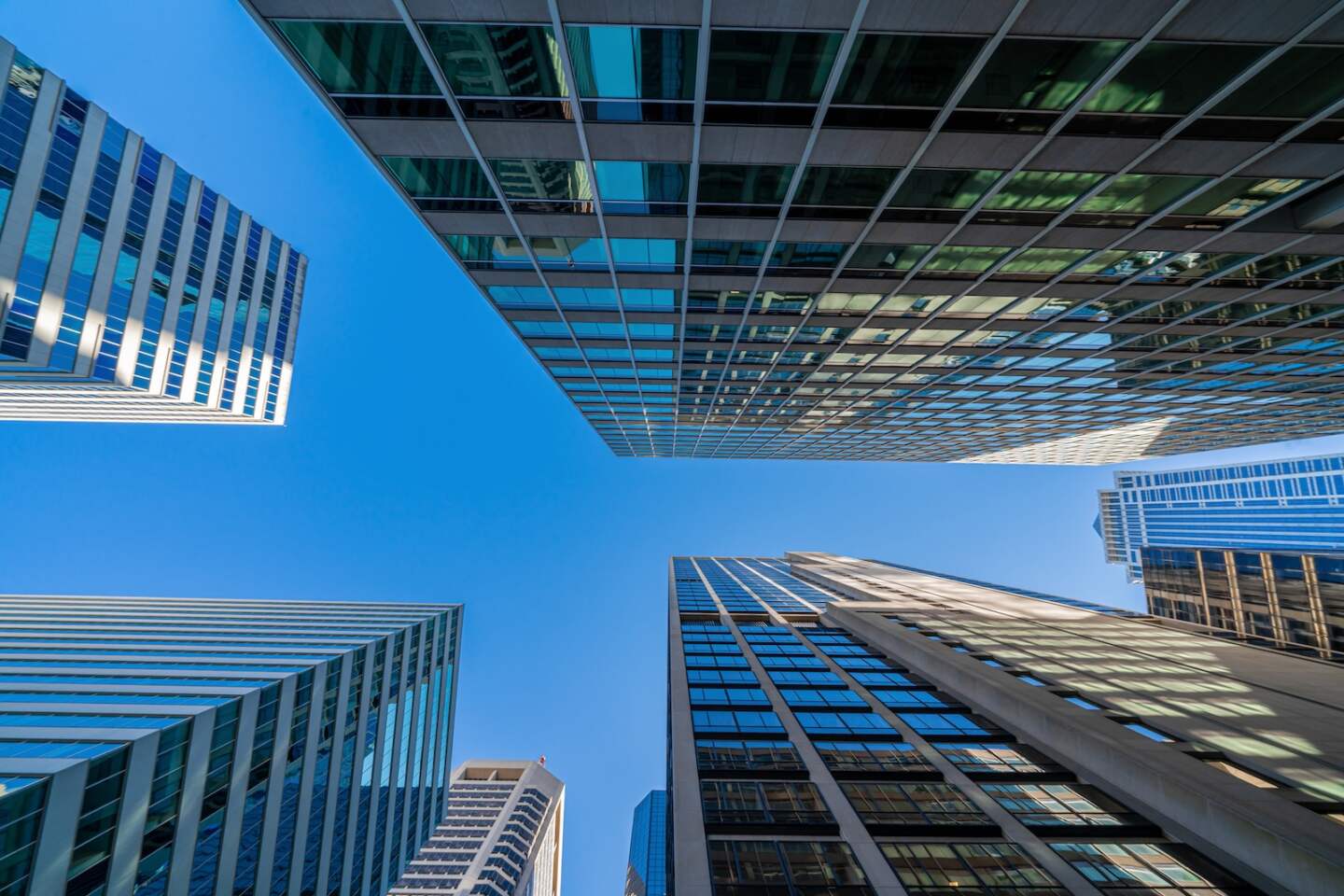 Modern office glasses buildings cityscape under blue clear sky in Washington DC, USA, outdoors financial skyscraper concept, symmetric and perspective architecture