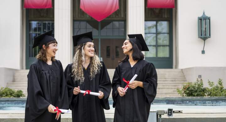 University students in graduation gowns