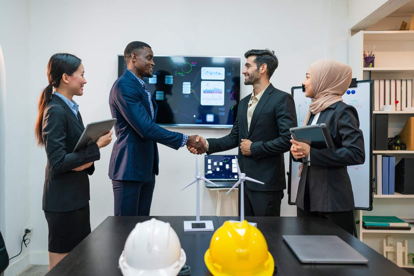 Professional business people are working and shaking hands while working in the creative office.