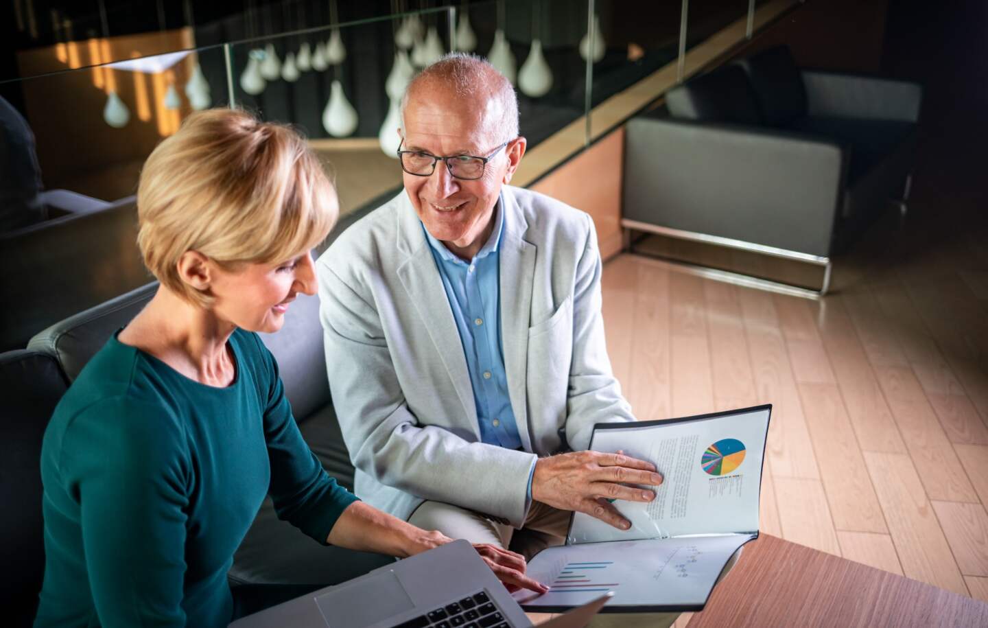 Businessman And Businesswoman Meeting In Modern Office