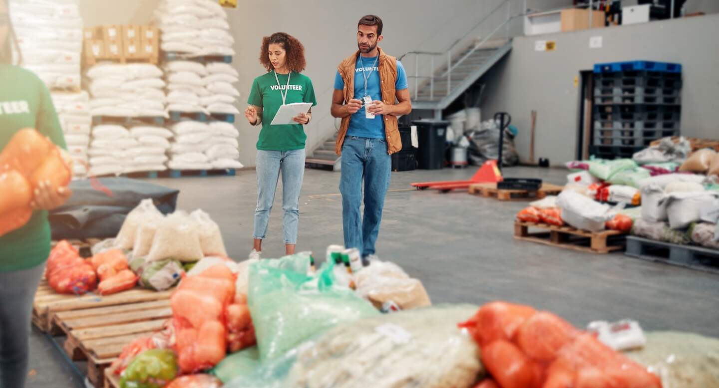 People, volunteer and walk with clipboard at warehouse for inspection, stock checklist and grocery .