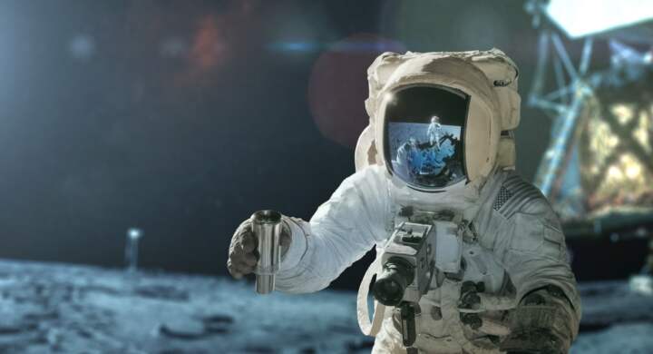 Space man in a spacesuit with a camera takes a soil sample and explores the moon, concept. Lunar expedition, creative idea. Man on the Moon